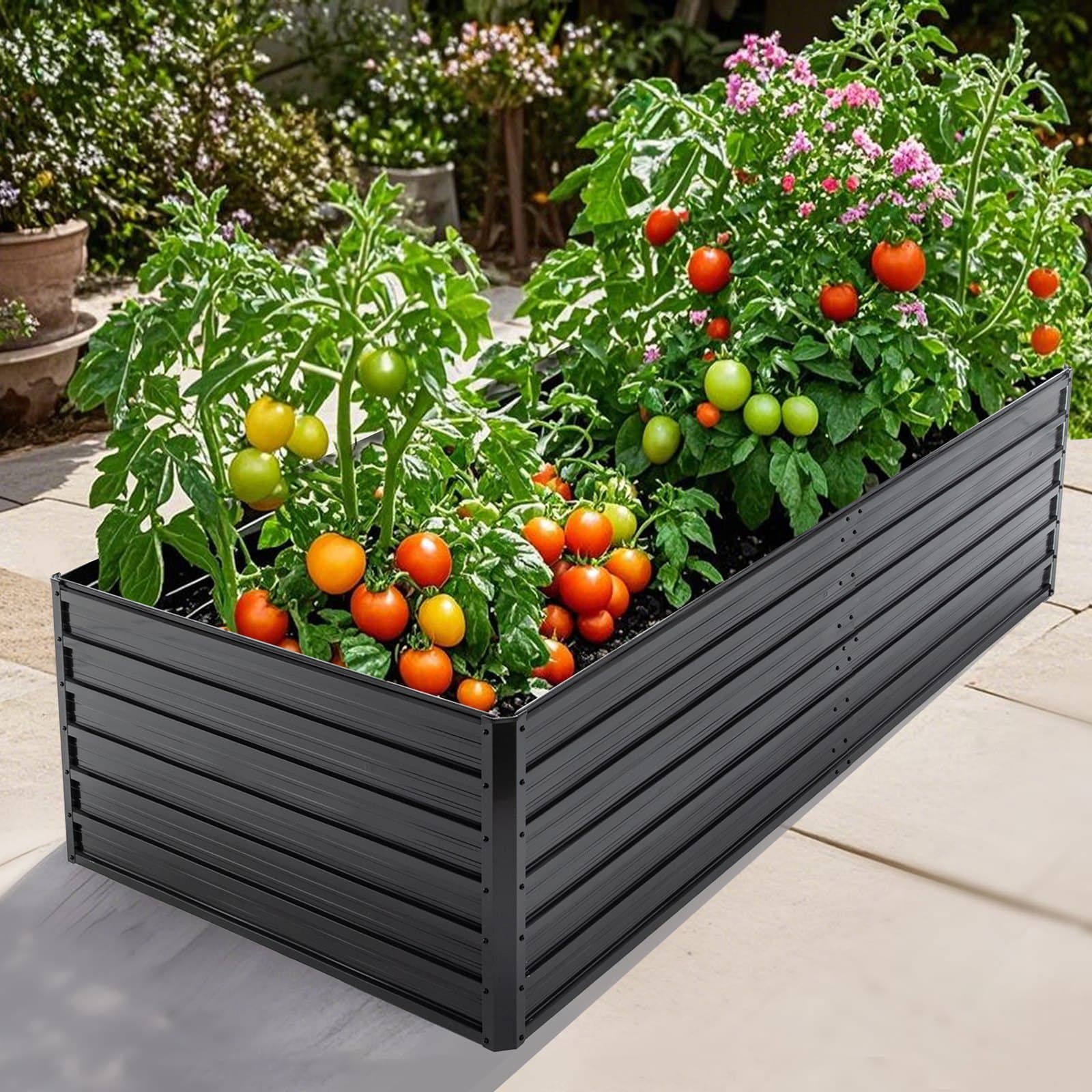 Elkstead galvanized steel raised bed full of tomatoes and flowers on a patio